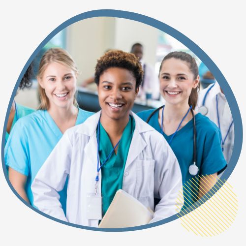 Three healthcare workers in scrubs happily invite you to explore the Manitoba Provincial Nominee Program (MPNP) for a fulfilling career in Manitoba, Canada.